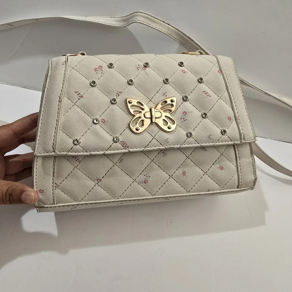 Under One Sky Cream Quilted Crossbody Bag with Gold Butterfly